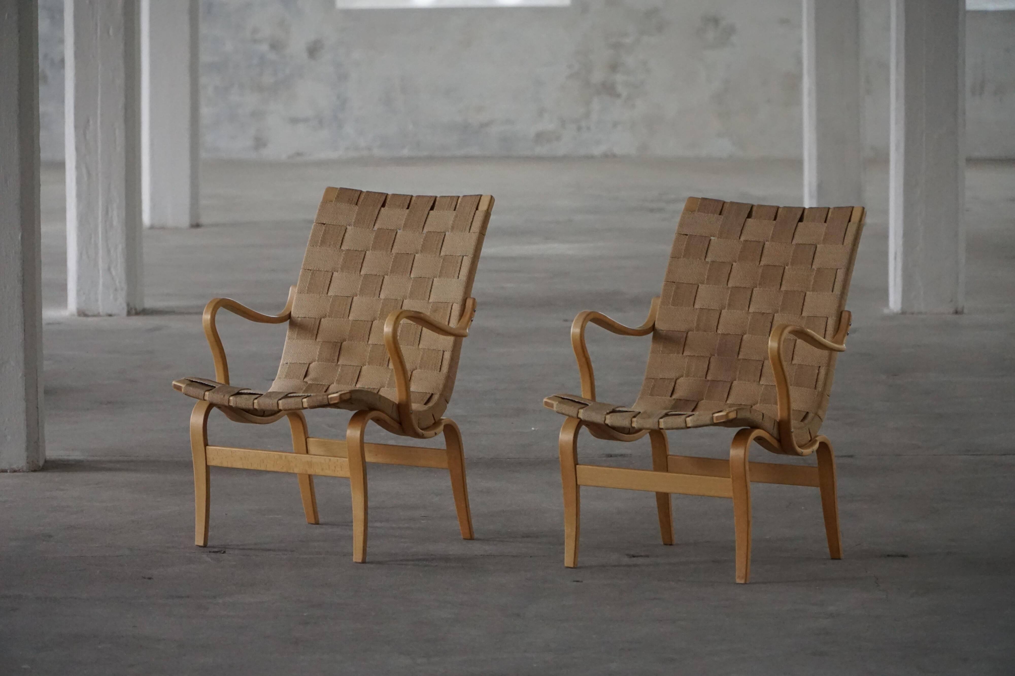 Pair of Swedish armchairs from the mid-century by Bruno Mathsson, model "Eva", 1960s.