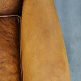Sheepskin wingback chair with a unique design and a beautiful patina