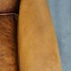 Sheepskin wingback chair with a unique design and a beautiful patina