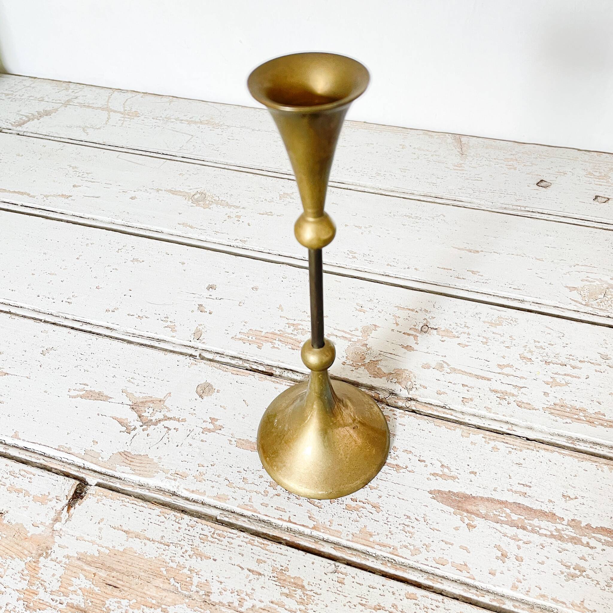 Tapered brass candle holder