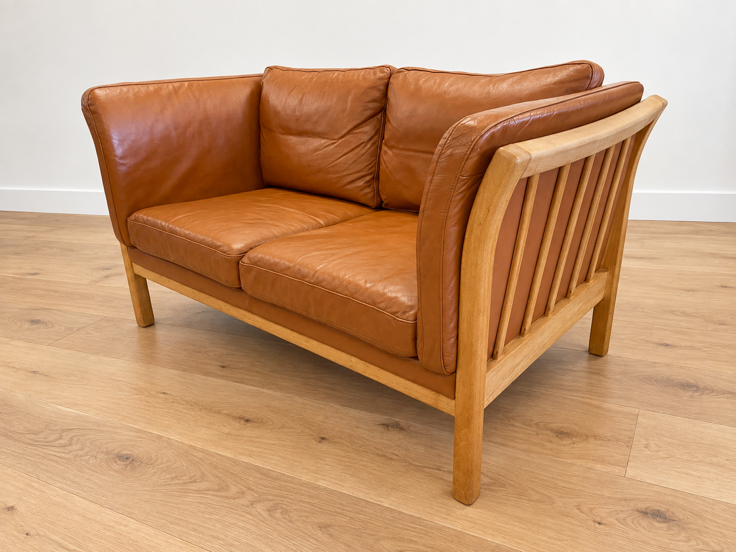 Vintage Danish 2 person sofa in cognac leather with oak frame