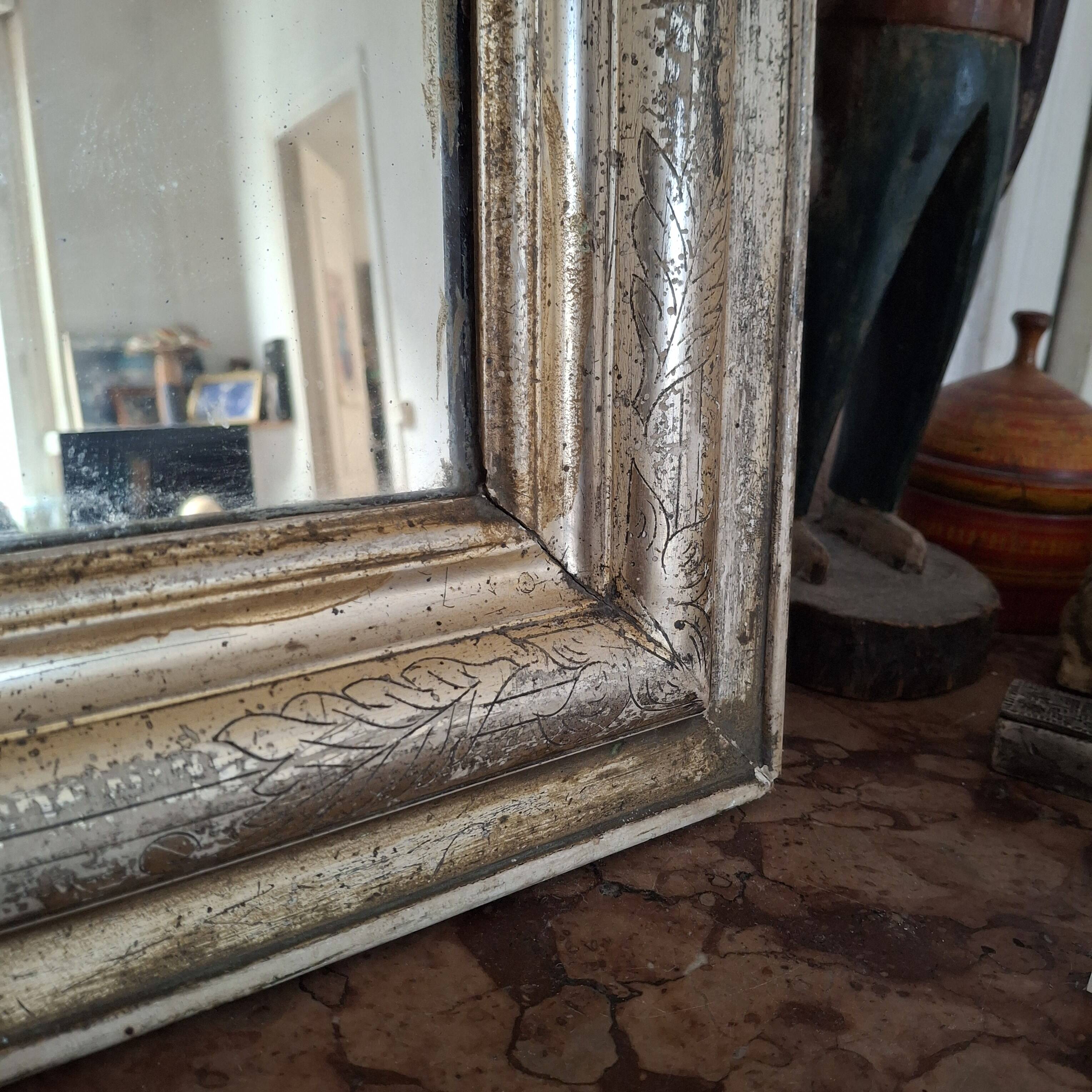 Antique Louis Philippe silvered mirror.
