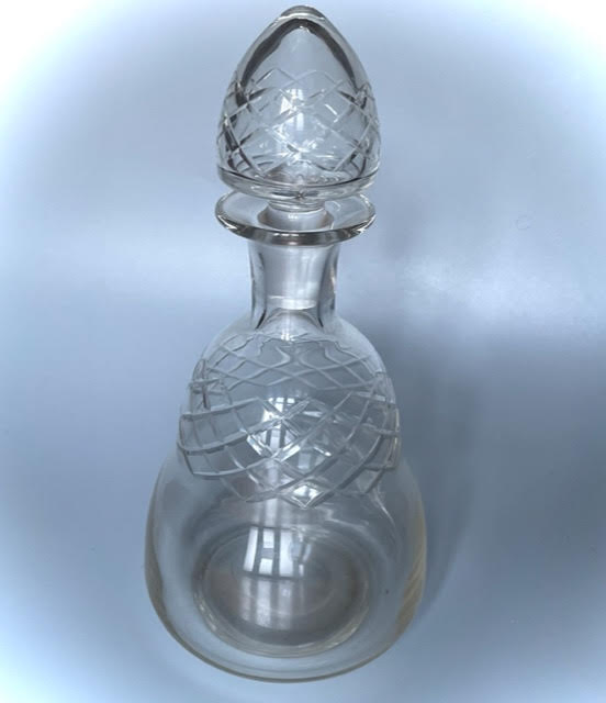 Old carafe in blown glass pattern engraved braces