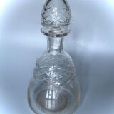 Old carafe in blown glass pattern engraved braces