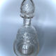 Old carafe in blown glass pattern engraved braces