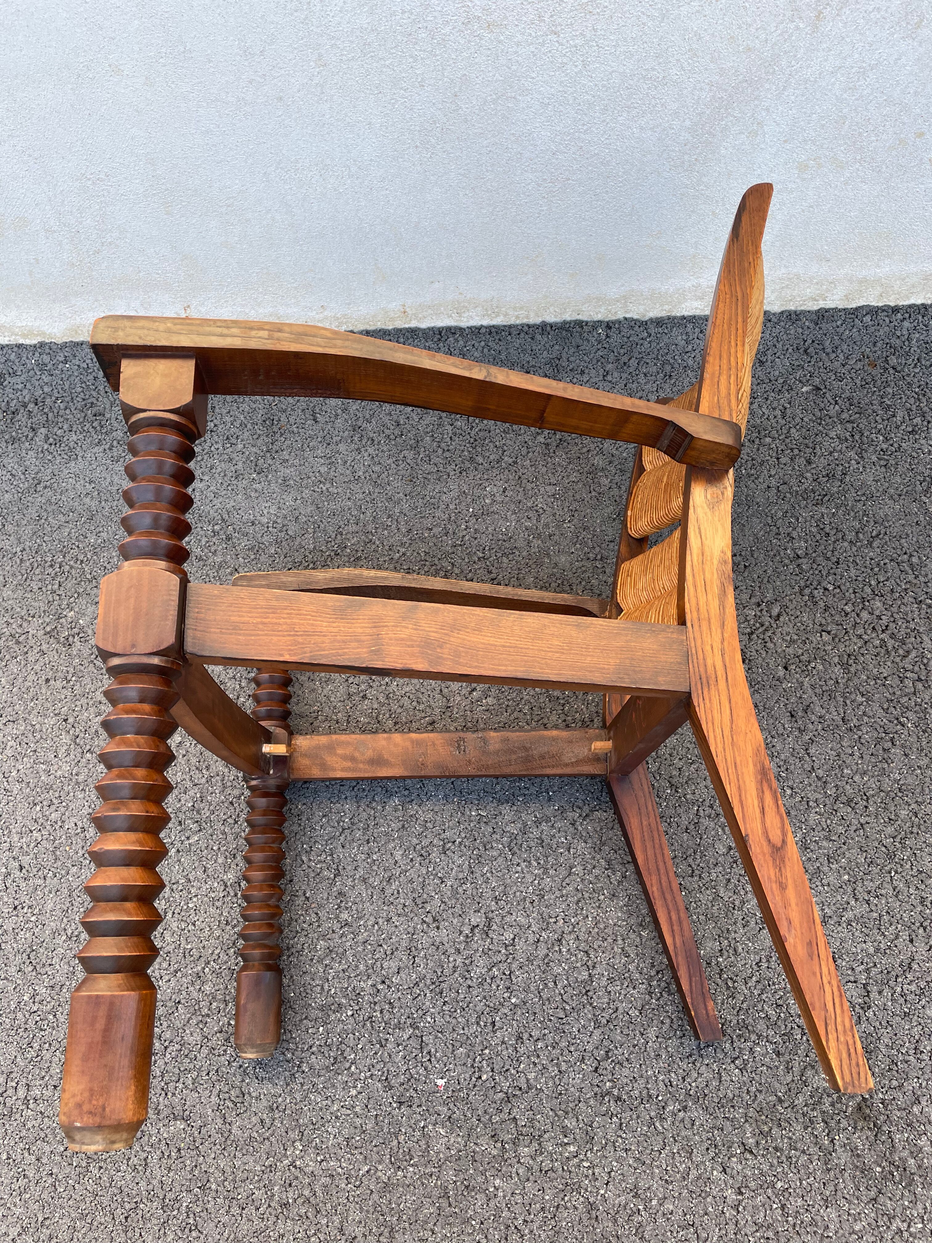 Vintage armchair in straw and brutalist wood