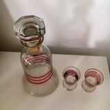 Glass carafe and two glasses