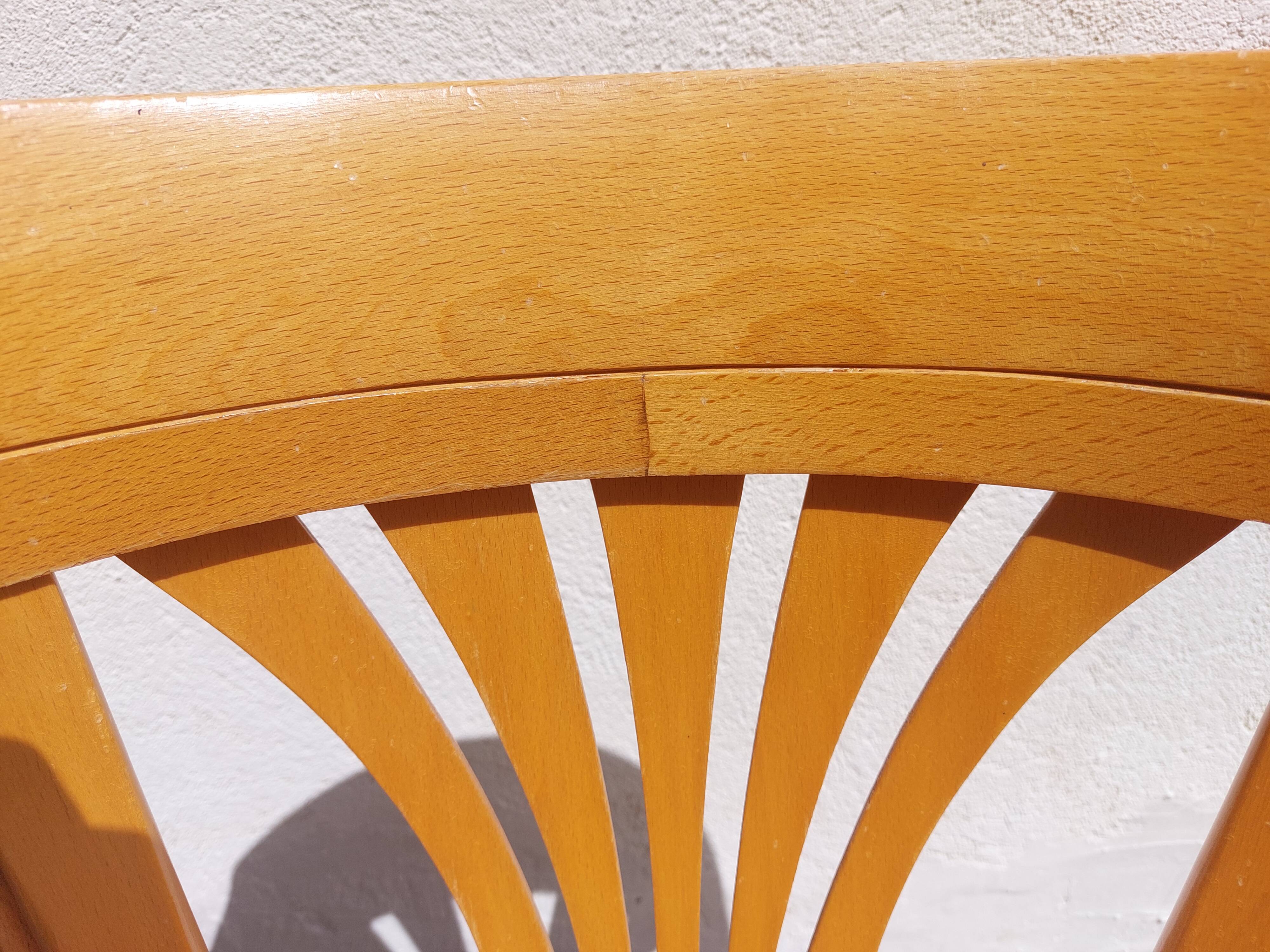 swivel armchair in wood and cane