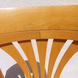 swivel armchair in wood and cane