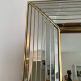 Large vintage Hollywood Regency style mirror with shutters.