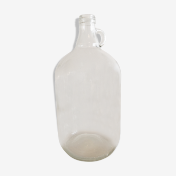 Demijohn in vintage transparent glass