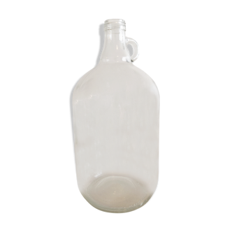 Demijohn in vintage transparent glass