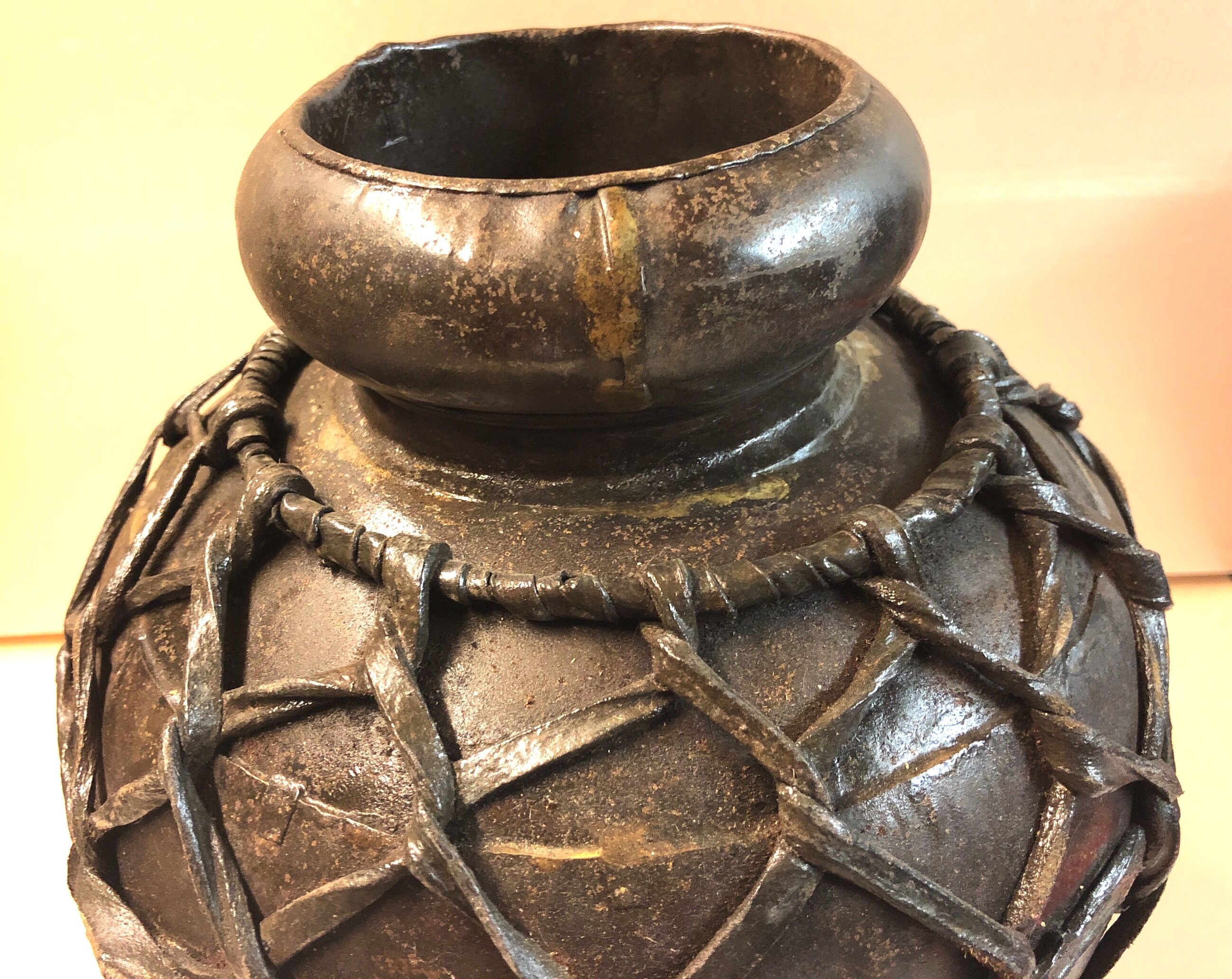 Metal and leather vase
