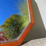 Octagonal beaded wooden mirror
