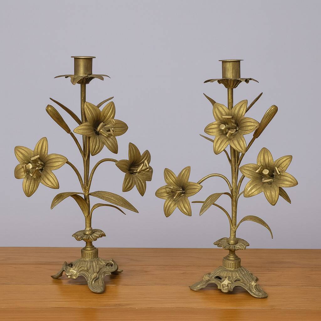 Pair of church candlesticks in bronze with floral decorations.