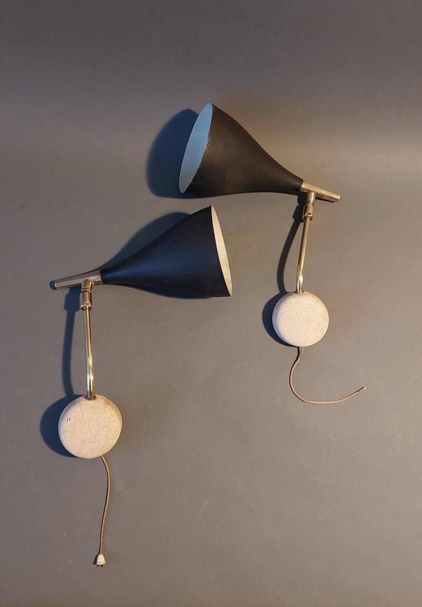 Pair of bedroom sconces in gilded brass and black aluminum 1960.