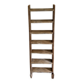 Decorative wooden ladder or towel rack.