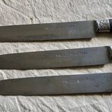Set of 12 19th century table knives with ebony and chiseled silver handles