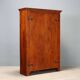 Vintage walnut wardrobe with exposed hardware.