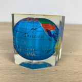 Globe paper press under resin