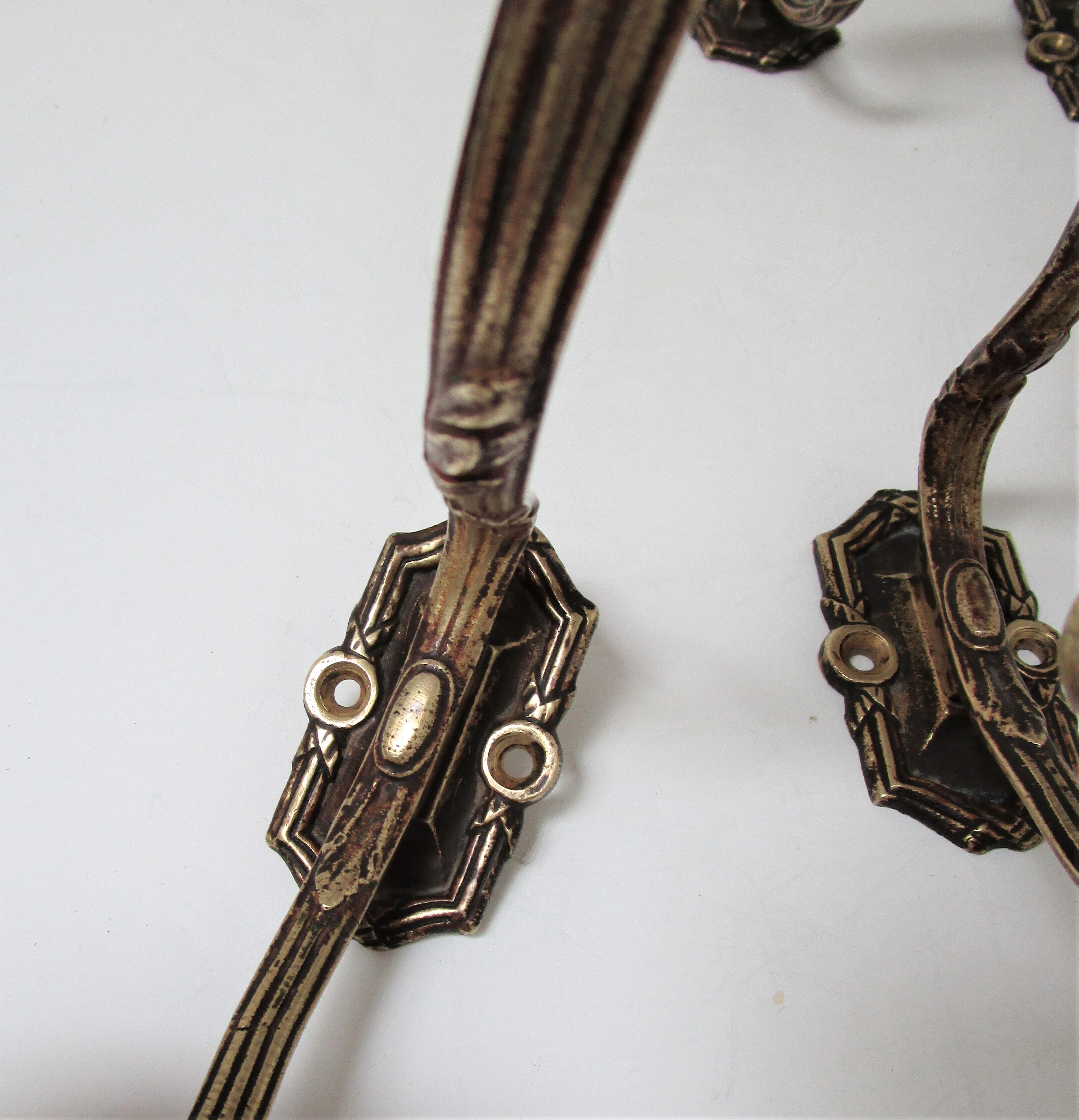 Four patères bronze patinated leafy décor early 20th century