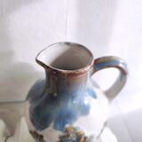 Small ceramic pitcher decorated with grapes