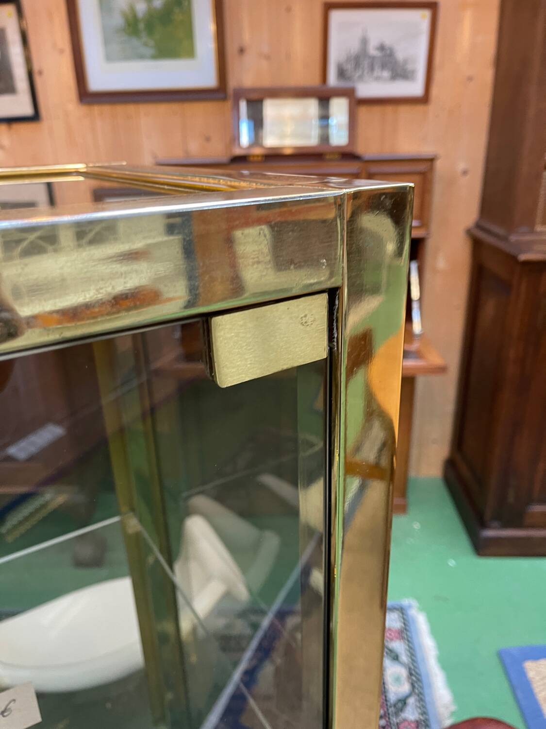 Exhibition showcase in gold-plated chrome and smoked glass - work from the 1980s.