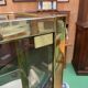 Exhibition showcase in gold-plated chrome and smoked glass - work from the 1980s.