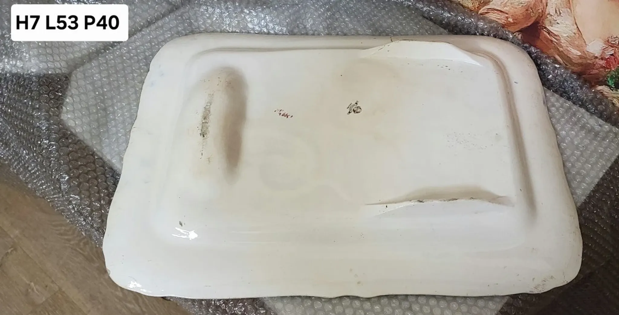 Very large rectangular dish with scalloped edges, made of fine glazed earthenware.