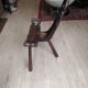 Rustic wooden tripod chair