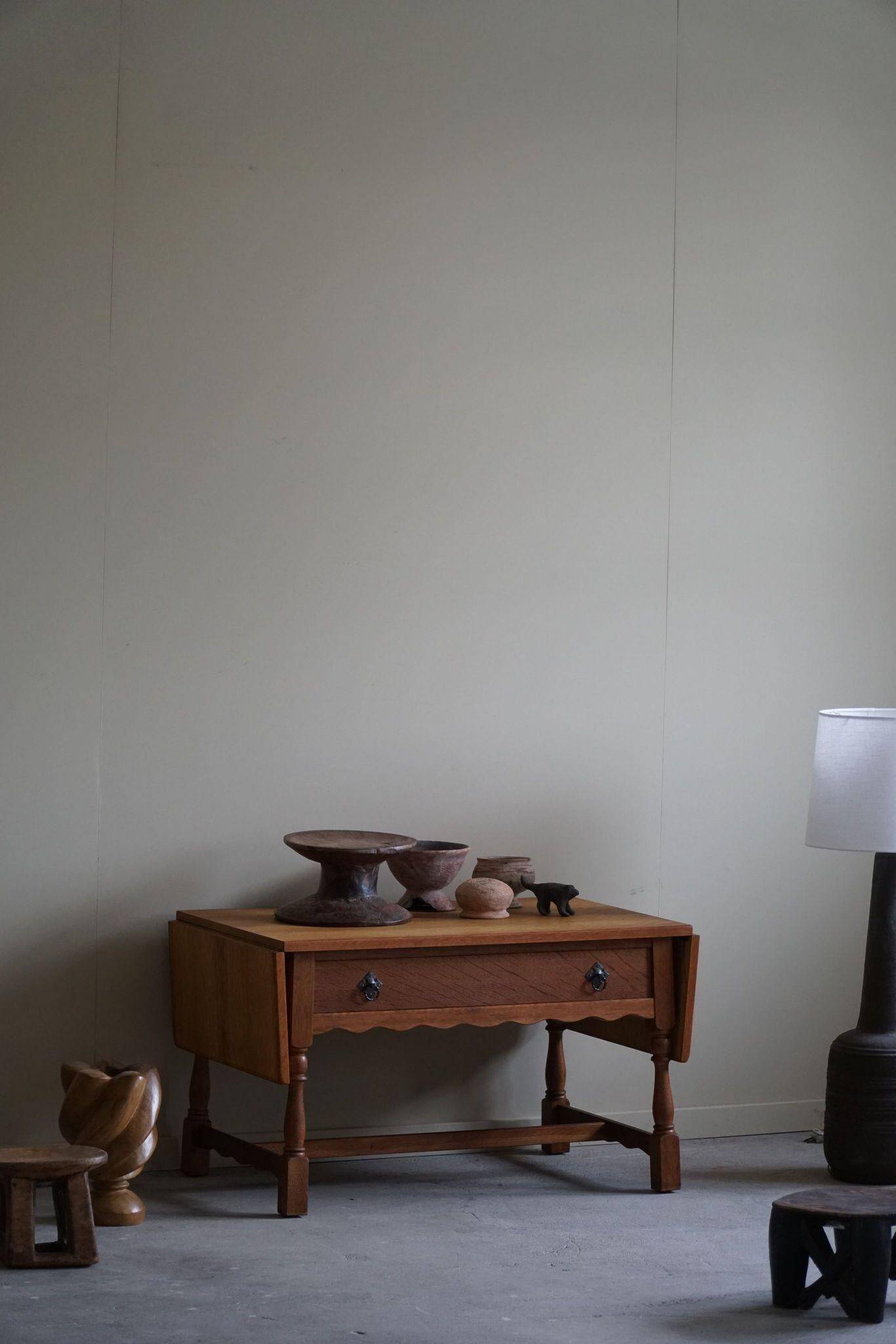 Danish folding table from the mid-century with a drawer in oak, Henning Kjærnulf, 1960s.