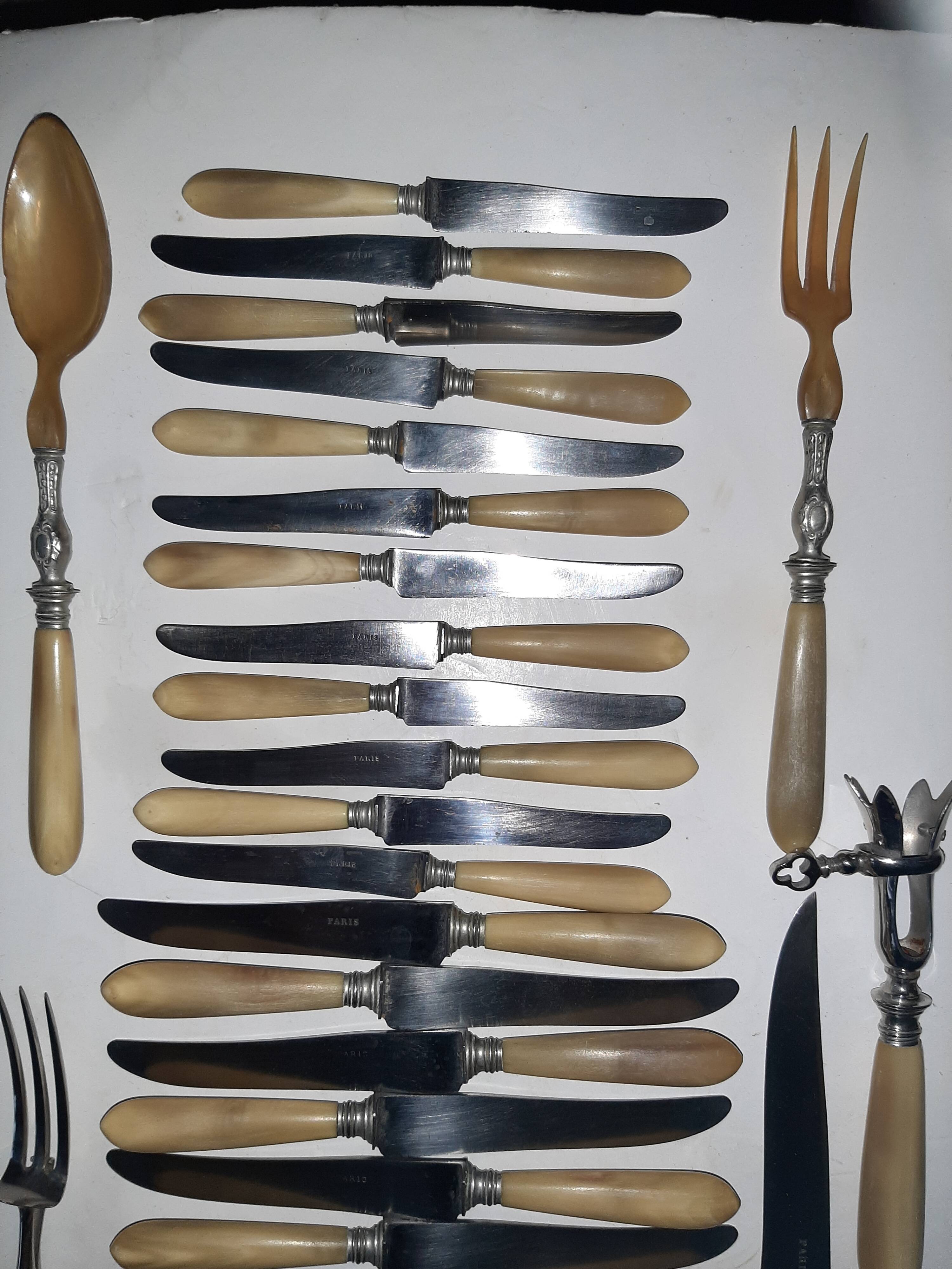 29-piece horn cutlery set, knives and serving utensils.