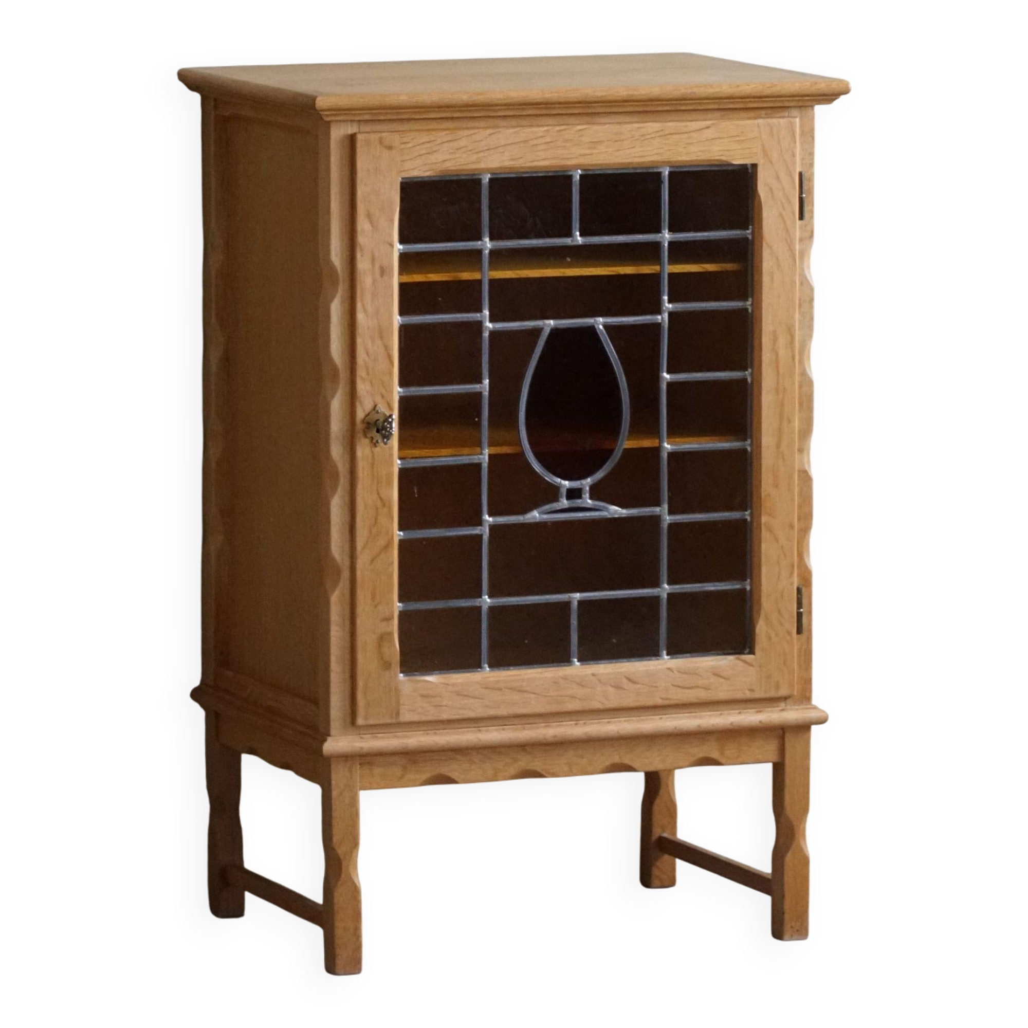 Scandinavian wardrobe in natural oak with a glass front.