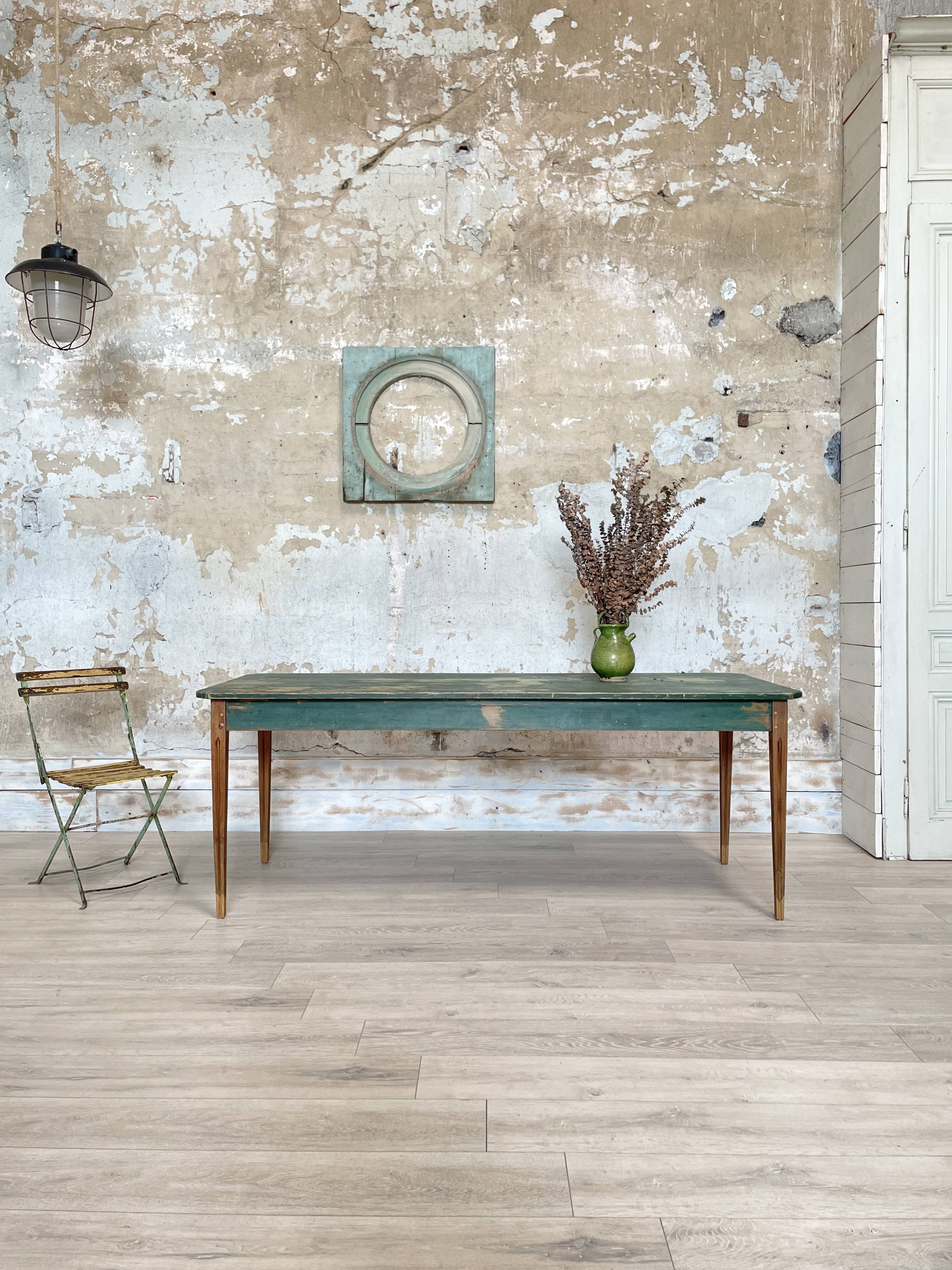 Vintage farm table with spindle legs.