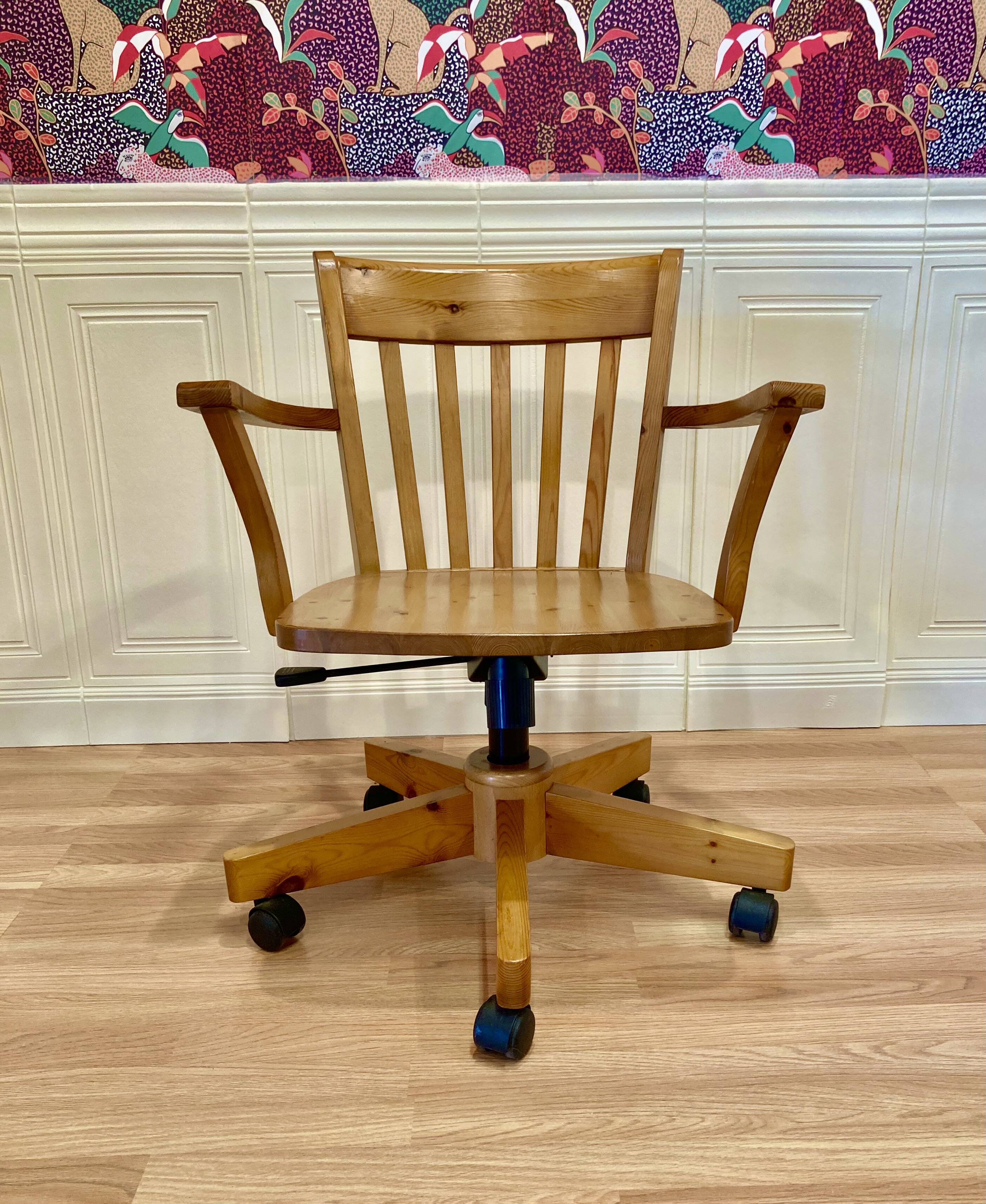 Solid wood swivel and reclining armchair.