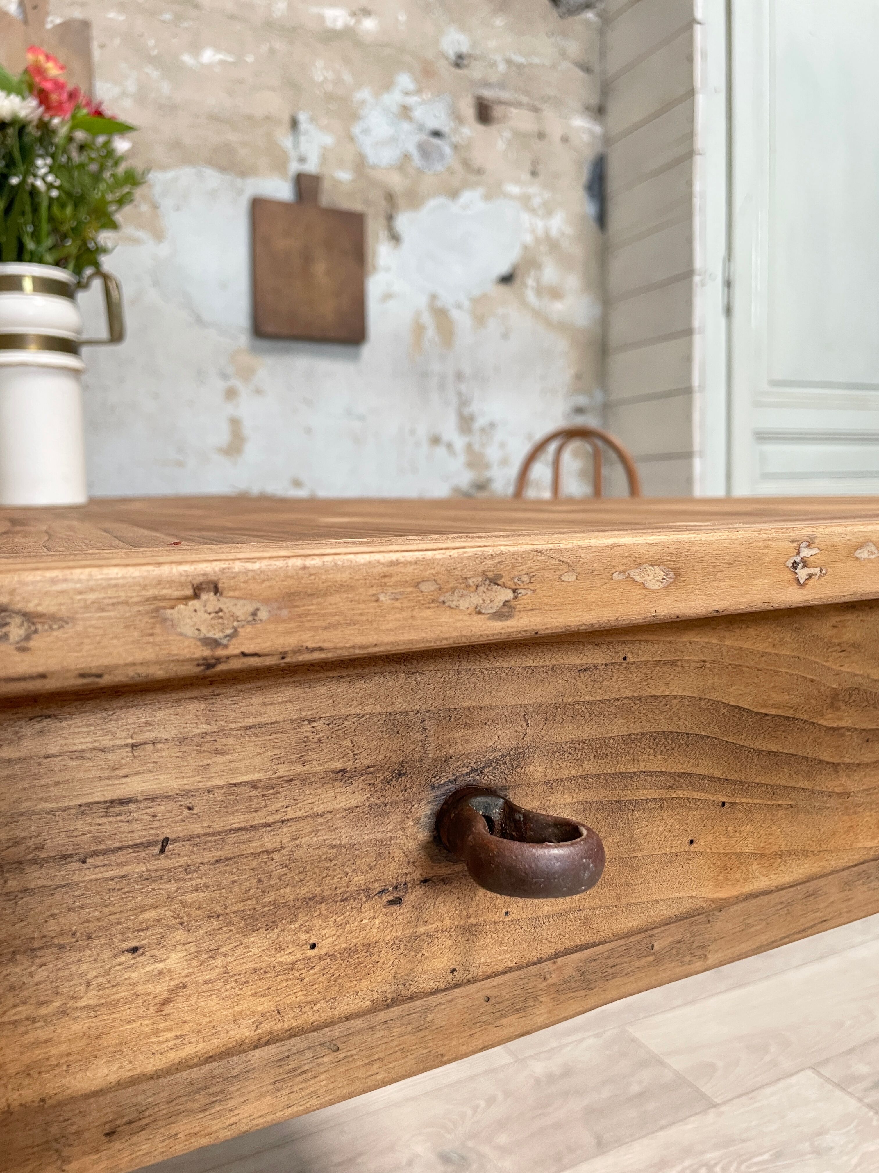 Vintage farmhouse table with turned legs.