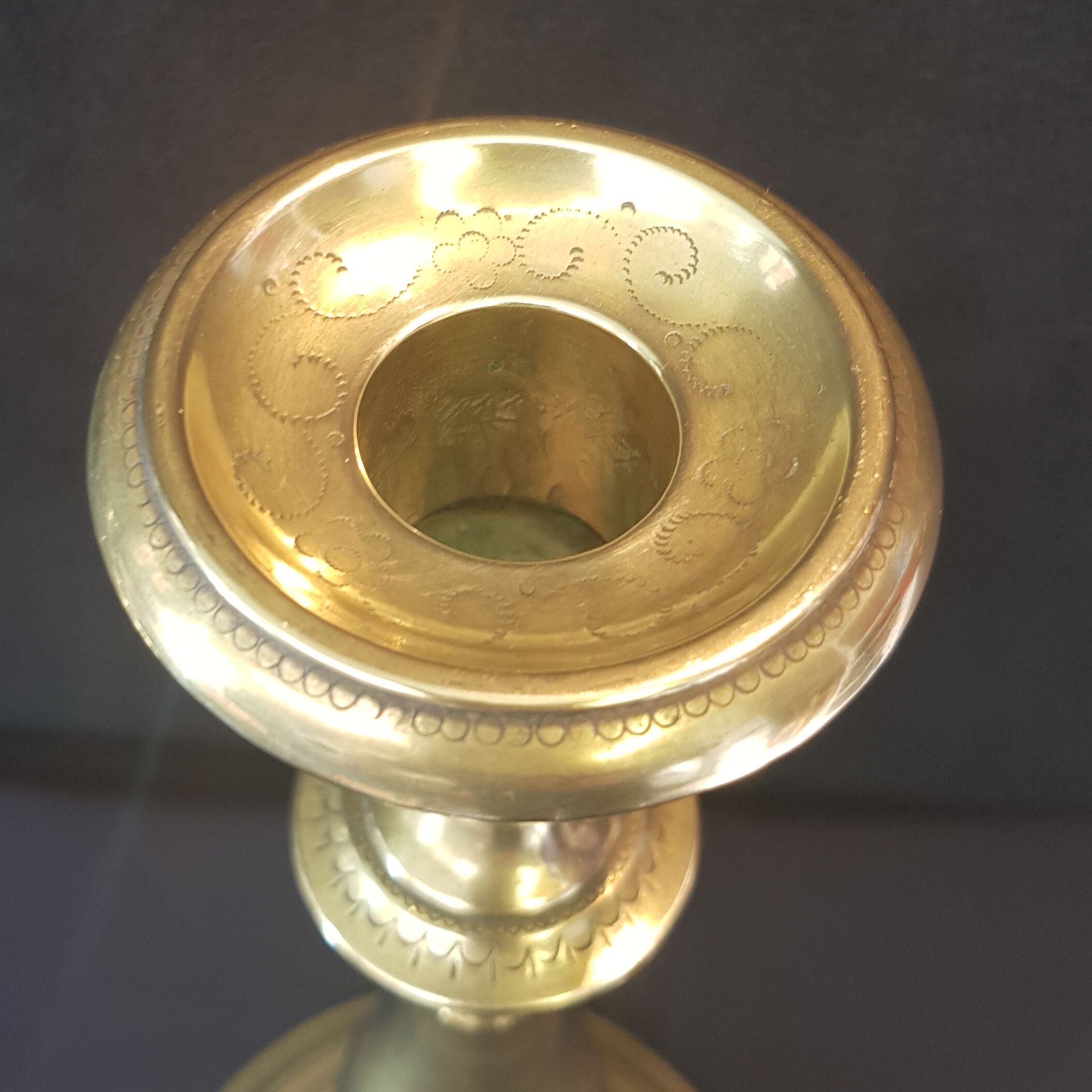 Chiseled gilded metal candlesticks