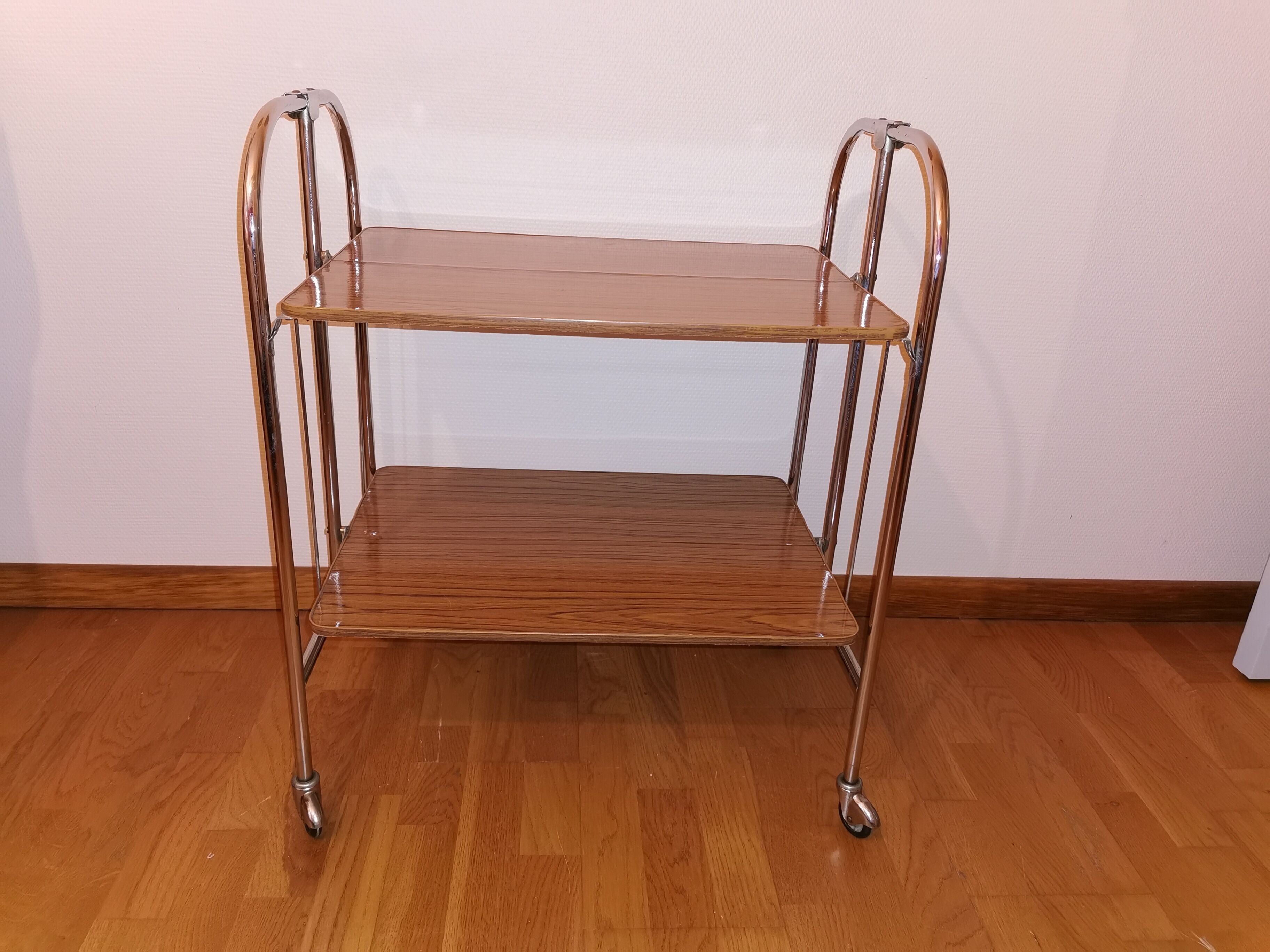 Vintage rolling and folding dessert trolley in chrome metal.
