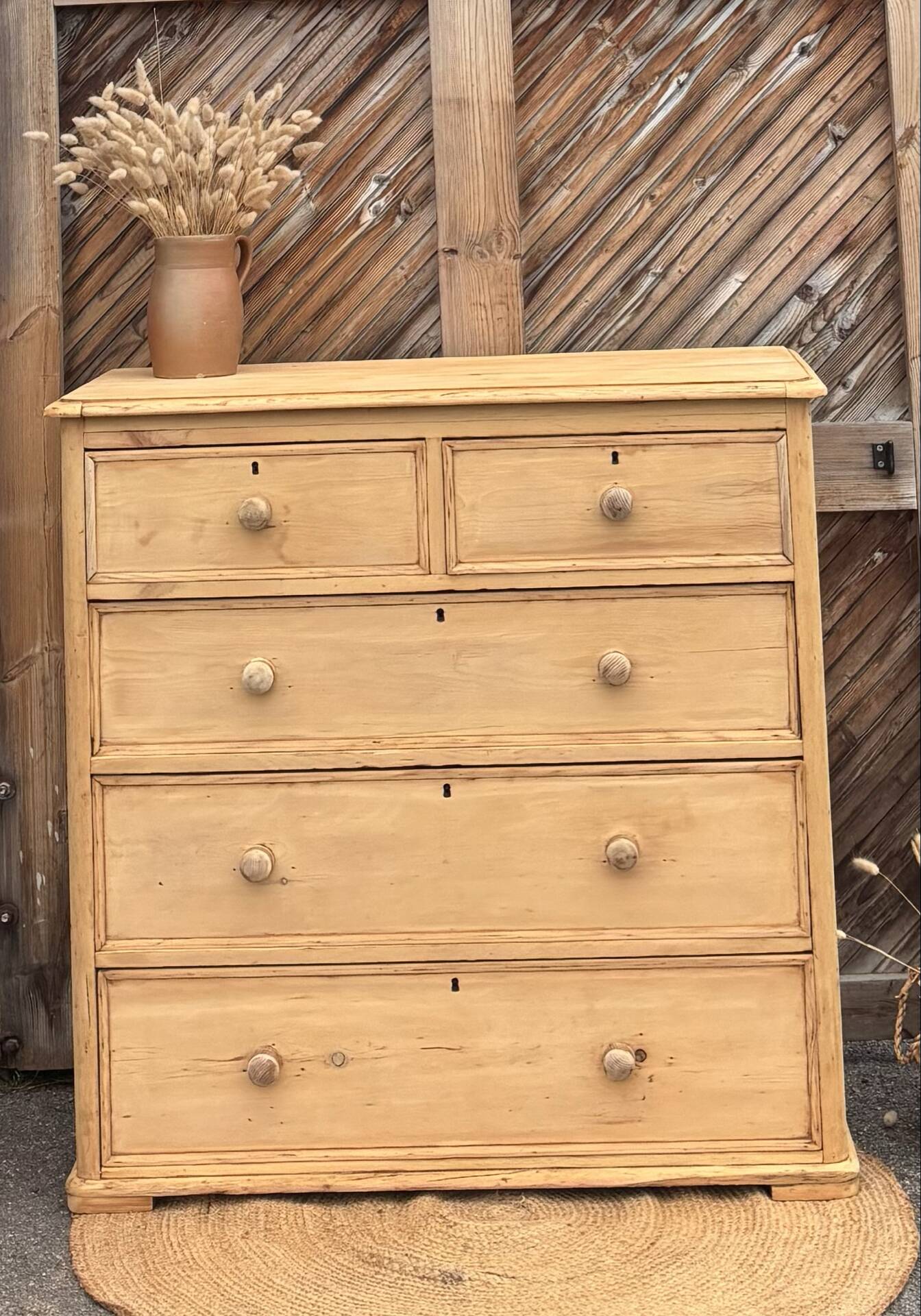 Large antique English chest of drawers in pitch pine.