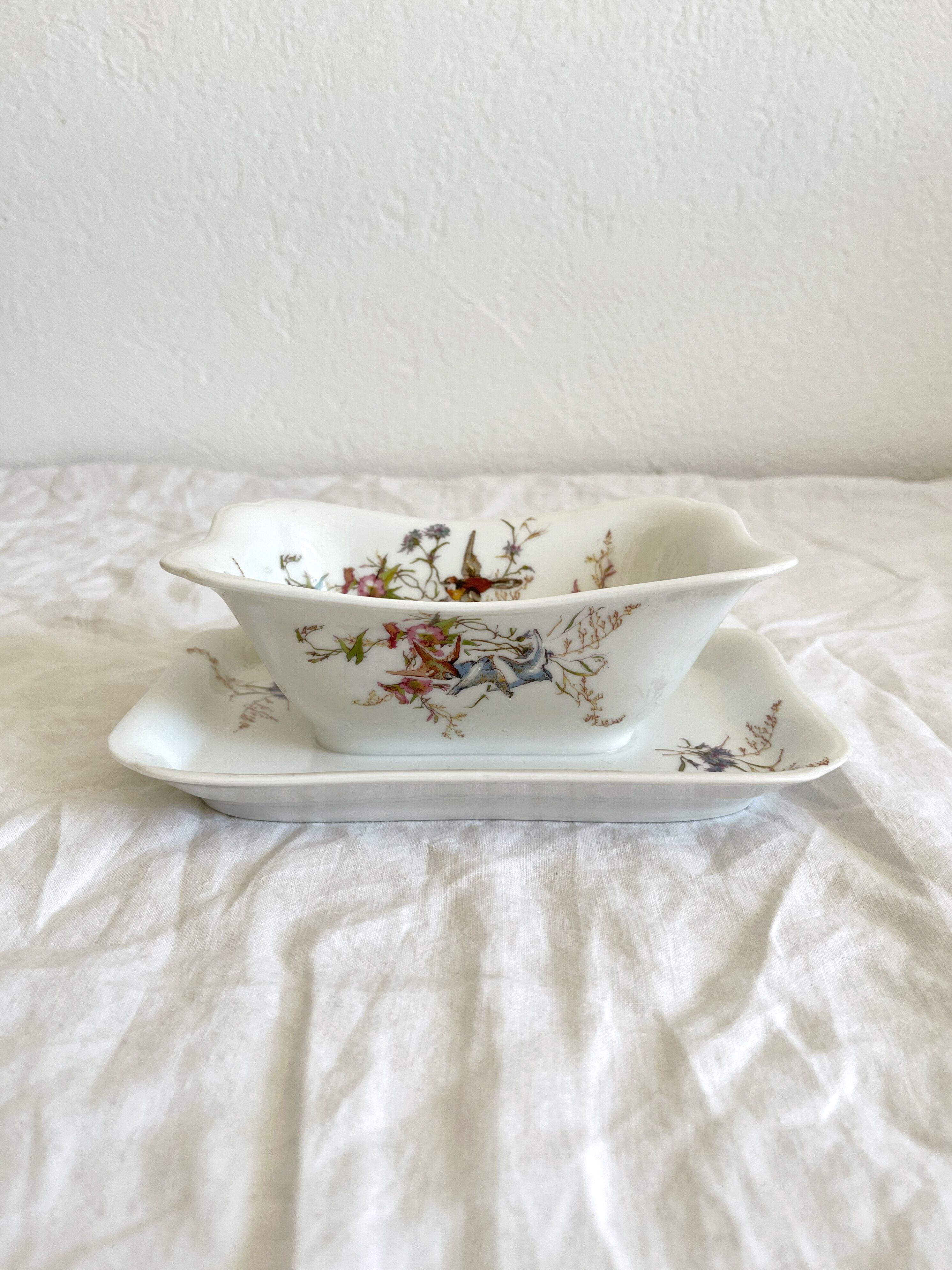 Rectangular sauce boat in Haviland Limoges porcelain with bird decoration