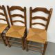 Set of 8 chairs in solid elm with straw seats.