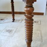Mid-19th-century walnut round table with shutters, flaps
