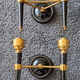 Pair of two-light torchiere wall lights in black lacquered metal and gilded brass, Circa 1960.