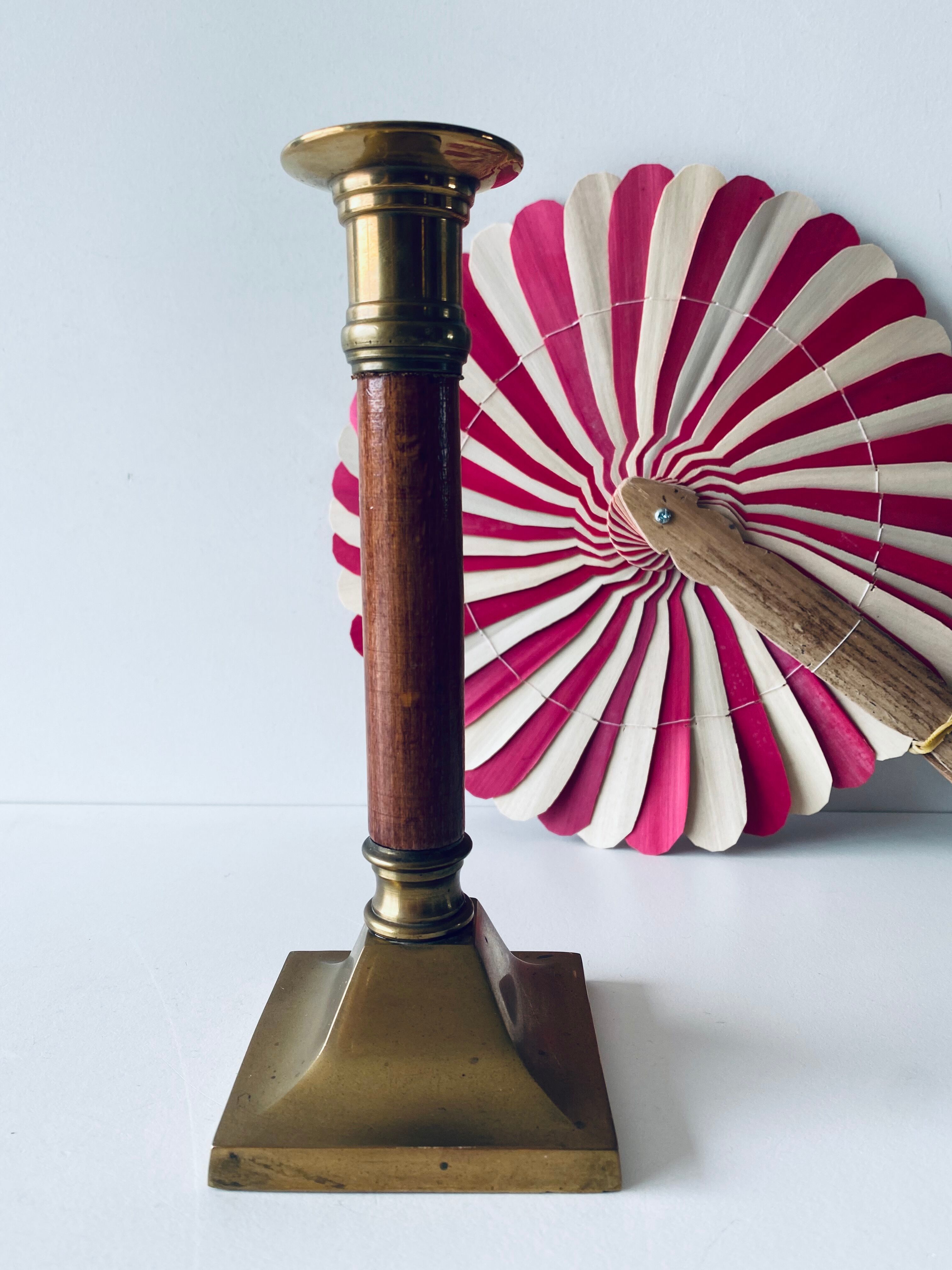 Old candle holder in brass and wood