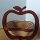 Foldable fruit basket in the shape of an apple.