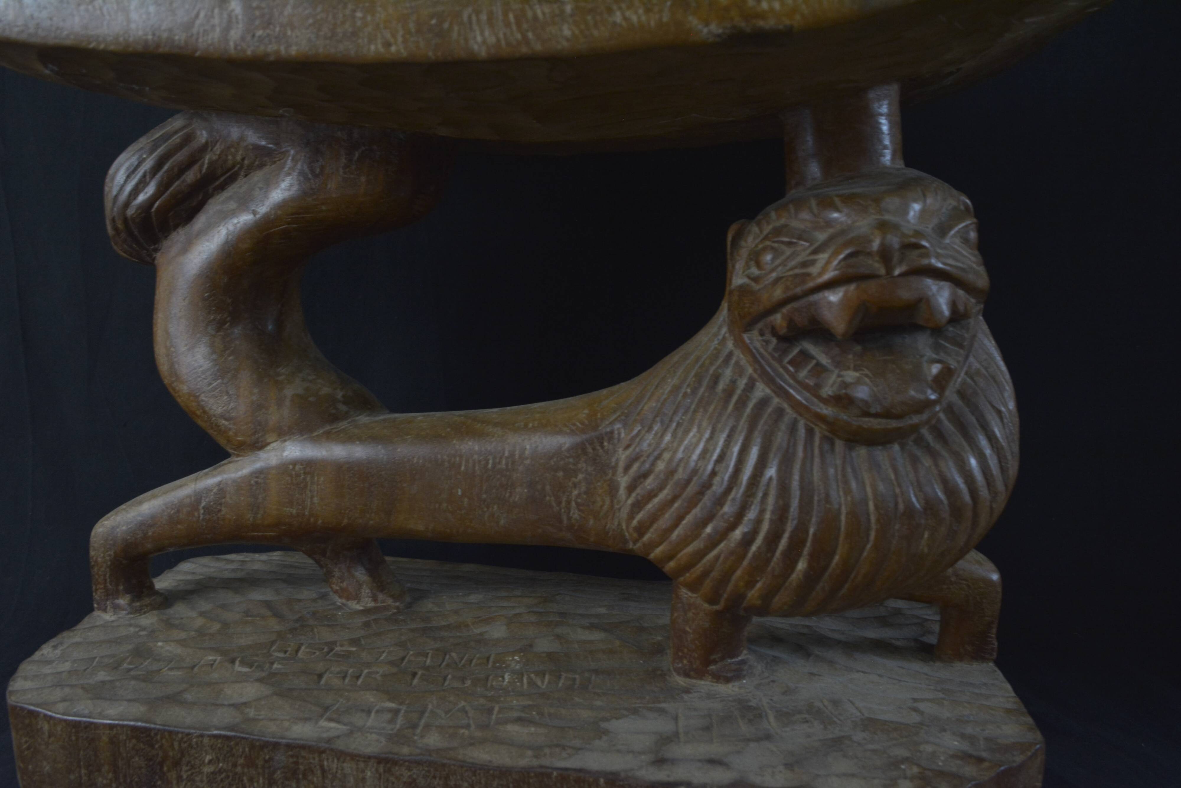 Togolese ethnic stool in carved exotic wood.