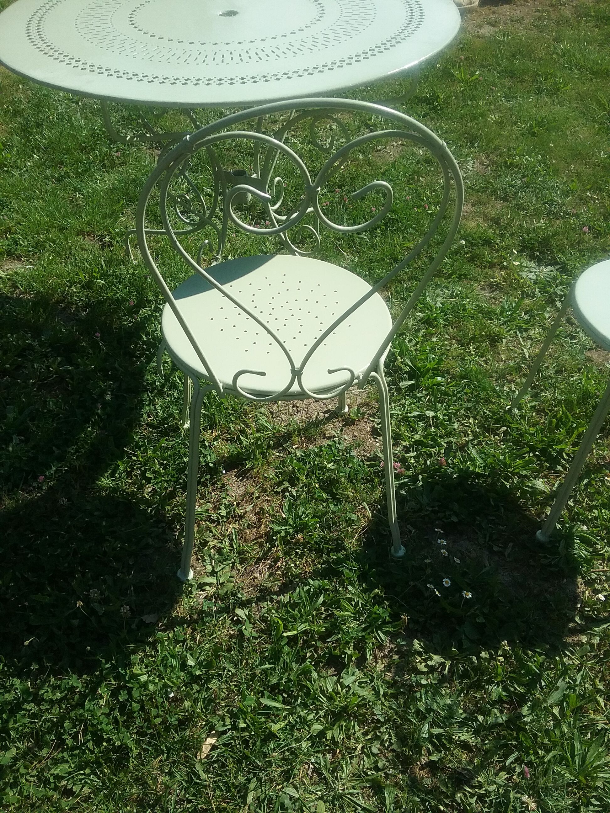 Green wrought iron garden furniture