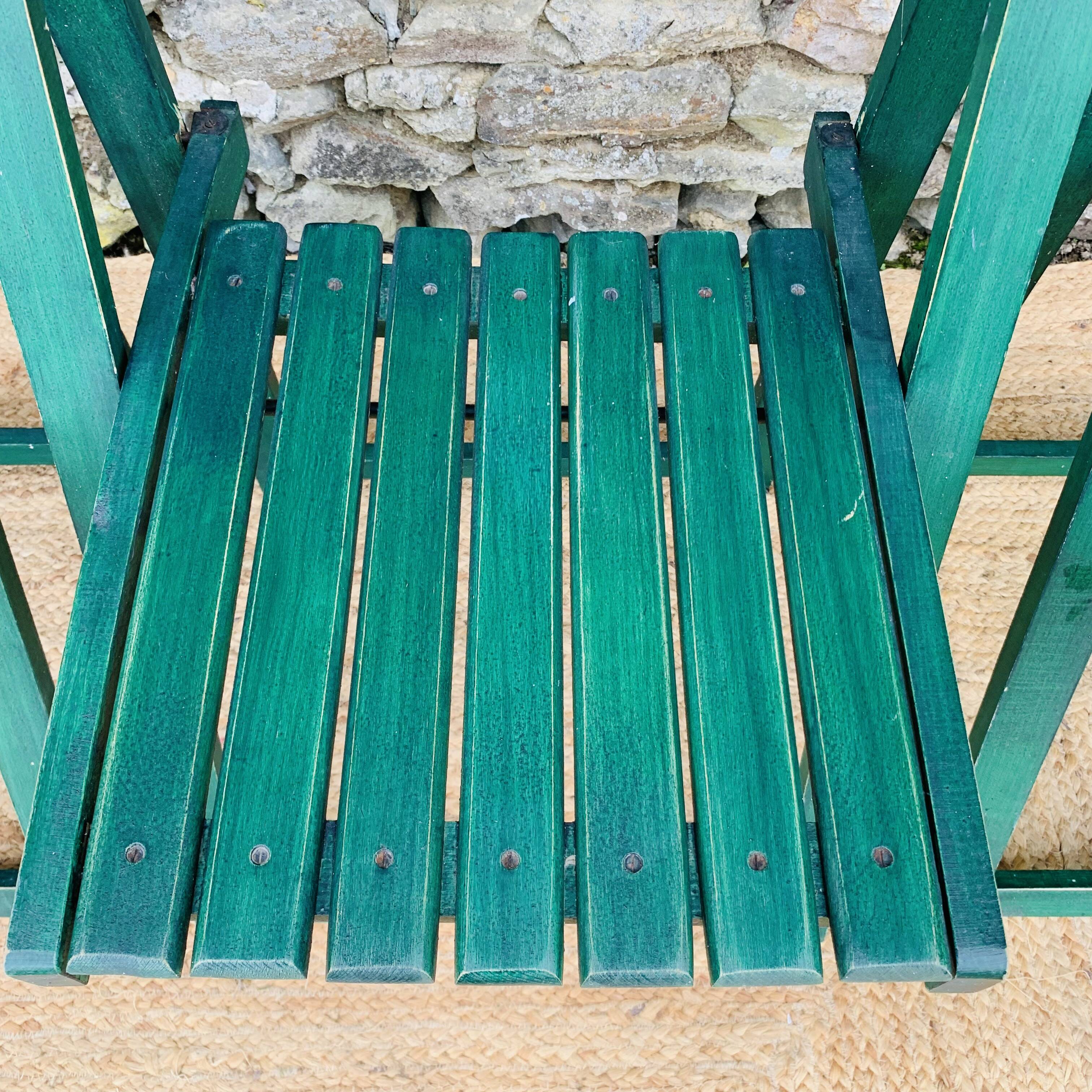 Set of 4 green folding chairs