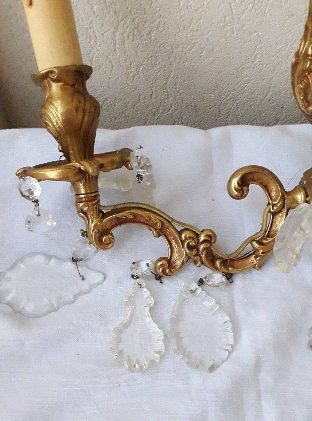 pair of bronze wall lights with pendants