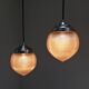 Paire de suspensions Holophane modèle goutte en verre strié circa 1940